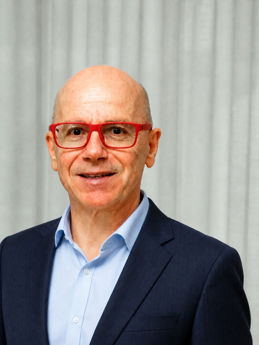 Portrait of Danilo Barbero in a navy-blue business suit and light blue shirt