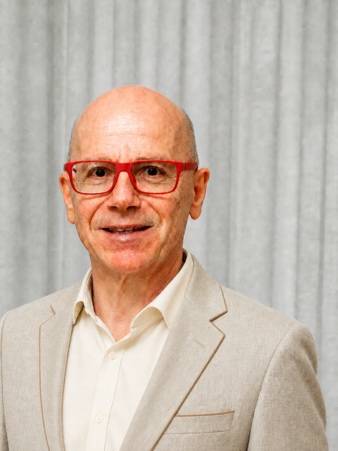 Portrait of Danilo Barbero in a light beige casual jacket with light brown trim and a cream shirt