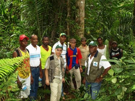Danilo Barbero and a field team standing in dense tropical vegetation